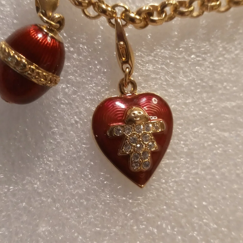 Faberge egg charm bracelet on a gold tone rolo chain. - Picture 9 of 16